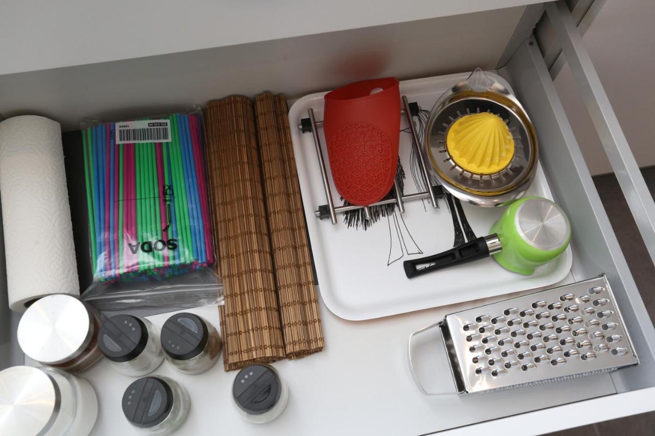 Kitchen drawer with neatly arranged amenities and utensils
